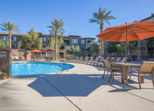 Pool Side Relaxing Area With Sundeck at The Passage Apartments by Picerne, Henderson, NV, 89014
