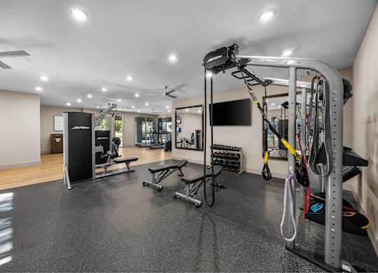 A well-equipped gym with a variety of exercise machines and equipment.at The Equestrian by Picerne, Nevada, 89052