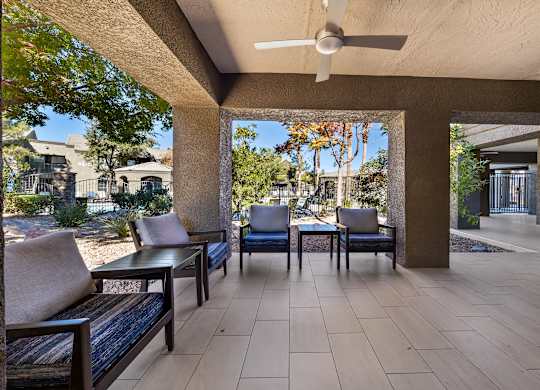 A patio with a table and chairs is shown.
