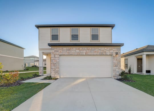 Front view from the driveway of the Maple floor plan at Beacon at Clinton Corners, Rental Homes in Dade City, FL