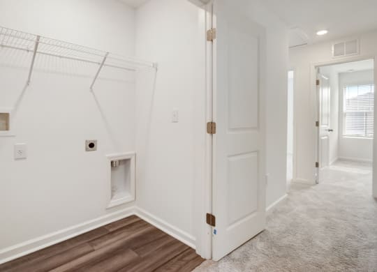 Efficient and organized laundry closet at Beacon at Arbours in Ruskin, FL