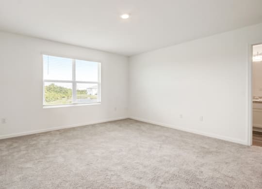 Unfurnished master bedroom with ample space at Beacon at Arbours in Ruskin, FL