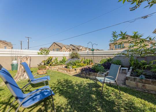 Gardening area with chairs at Encore at Buckingham apartments in Richardson, TX