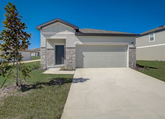 Front view from the driveway of the Elm floor plan at Beacon at Clinton Corners in Dade City, FL