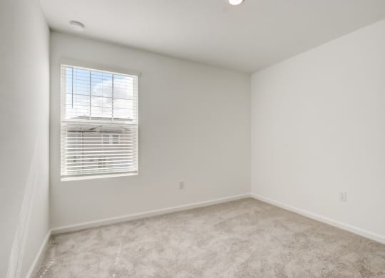 Third bedroom with white walls and a window area at Beacon at Arbours in Ruskin, FL