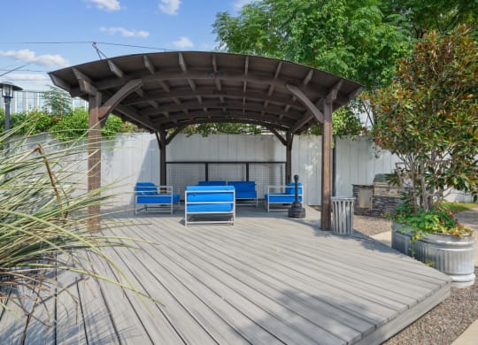 3333 Elm Street patio with shaded seating  with blue chairs | Deep Ellum Lofts in Dallas, TX