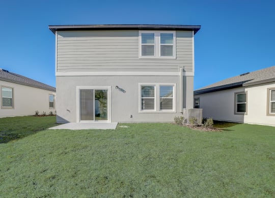 View of the Verbena floor plan house from the backyard at Beacon at Clinton Corners in Dade City, FL