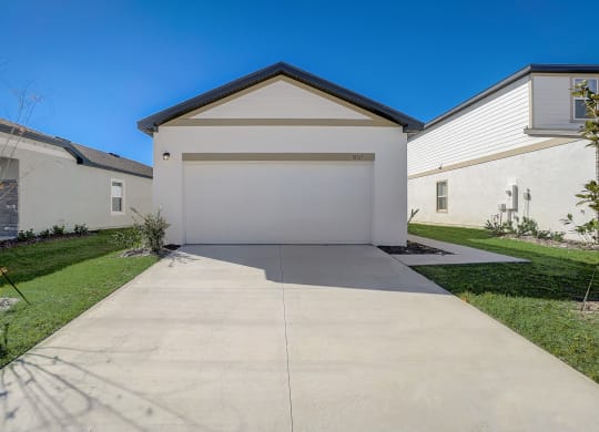 Front view from the driveway of the Aspen floor plan at Beacon at Clinton Corners, Rental Homes in Dade City, FL