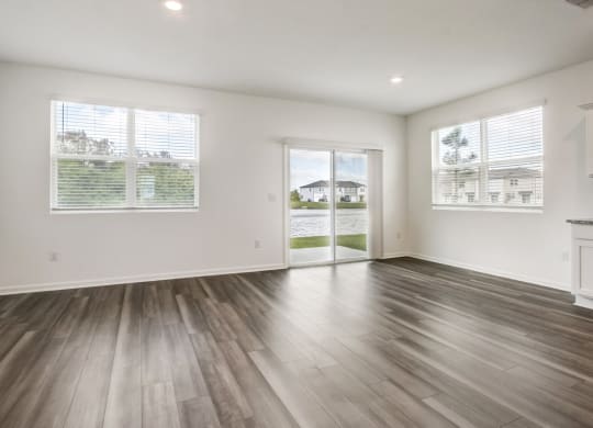 Open-concept living and kitchen area at Beacon at Arbours in Ruskin, FL