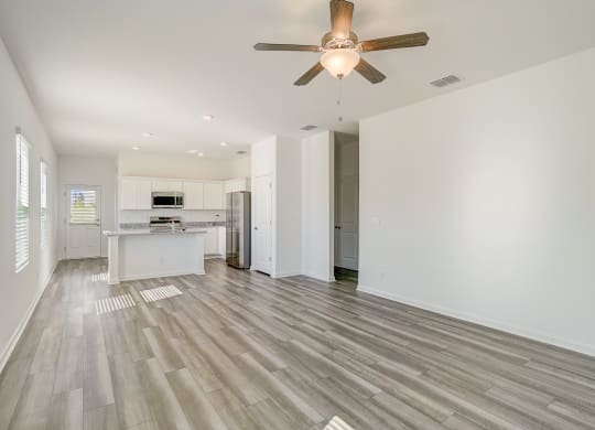 View from living room to kitchen in the Elm floor plan at Beacon at Clinton Corners in Dade City, FL