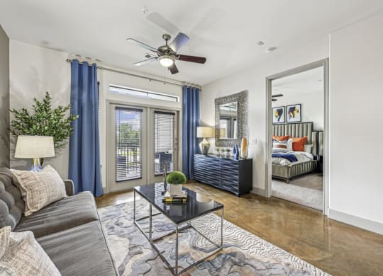 Stylish living room with modern furniture and decor at Allusion at West University apartments in Houston, TX