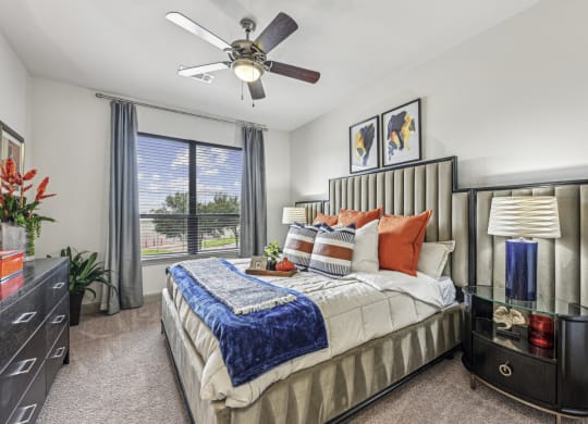 Inviting bedroom with large windows and natural light at Allusion at West University apartments in Houston, TX