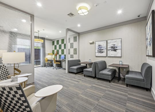 Spacious business center featuring private booths and a contemporary design at Allusion at West University apartments in Houston, TX