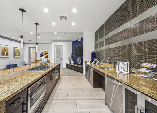Fully equipped catering kitchen with modern appliances and stylish finishes at Allusion at West University apartments in Houston, TX