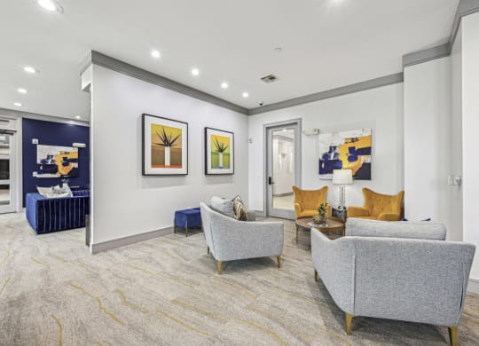Clubroom with comfortable seating and contemporary artwork at Allusion at West University apartments in Houston, TX