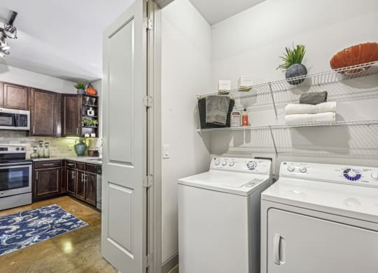 Convenient in-unit laundry area with a washer and dryer at Allusion at West University apartments in Houston, TX
