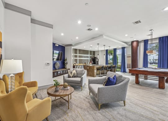 Stylish resident lounge with ample seating and contemporary art at Allusion at West University apartments in Houston, TX