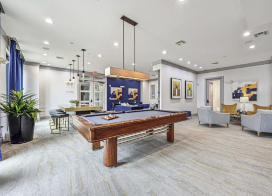 Cozy seating area in a resident lounge with modern decor at Allusion at West University apartments in Houston, TX