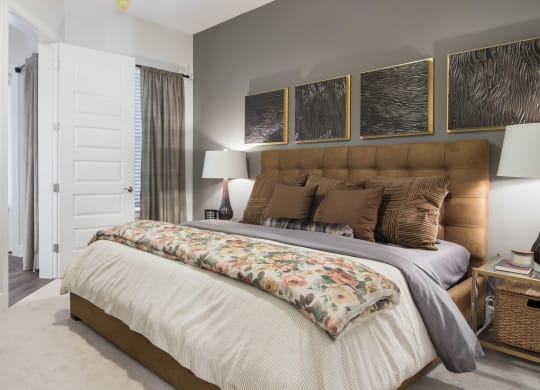 King Sized Bed In Bedroom at The Alastair at Aria Village, Sandy Springs, GA