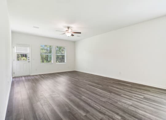 Bright and open living area with large windows at Beacon at Ashley River Landing in Summerville, SC