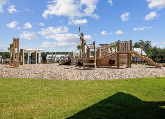 Playground in the shape of a boat with swing set and slide at Beacon at Ashley River Landing in Summerville, SC