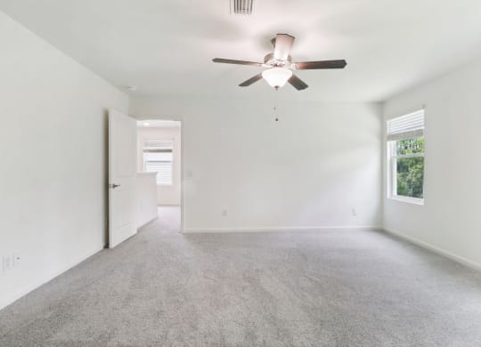 Sycamore bright bedroom with a window and carpet floor at Beacon at Ashley River Landing in Summerville, SC