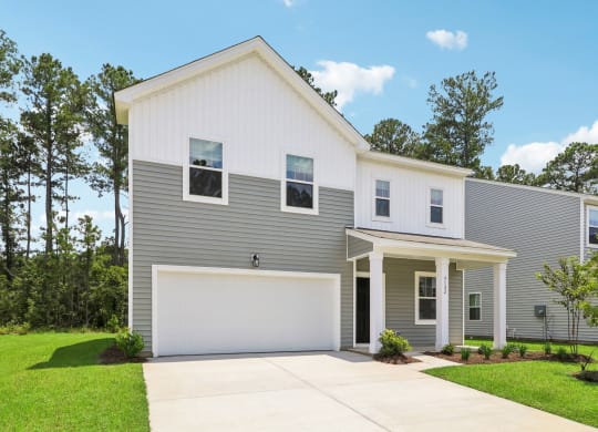 Sycamore Angled front view of a two-story house at Beacon at Ashley River Landing in Summerville, SC