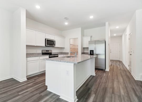 Sycamore modern kitchen with stainless steel appliances and white cabinetry at Beacon at Ashley River Landing in Summerville, SC