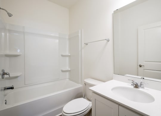 a bathroom with a sink toilet and bathtub at Beacon at Meridian, San Antonio, 78245