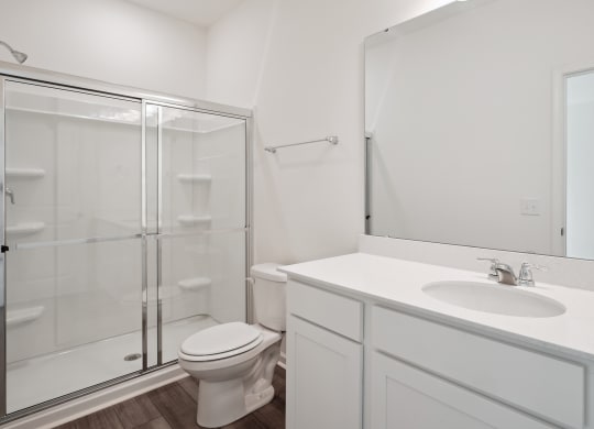 a bathroom with a toilet sink and shower at Beacon at Meridian, San Antonio, TX