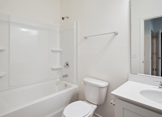 a bathroom with a bathtub toilet and sink at Beacon at Bunton Creek, Kyle, TX
