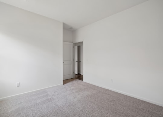 a bedroom with white walls and carpet at Beacon at Meridian, Texas, 78245