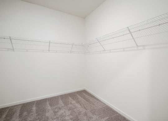 a walkin closet with white walls and white wire shelving at Beacon at Bunton Creek, Kyle, 78640