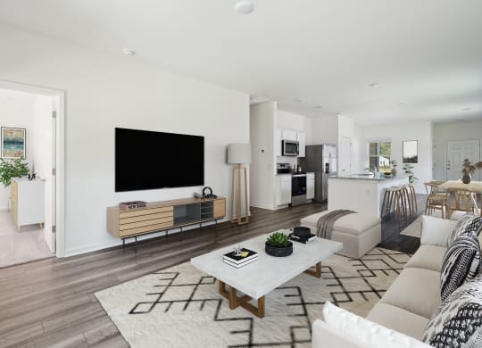 Sequoia living room furnished with couch and entertainment center at Beacon at Ashley River Landing in Summerville, SC
