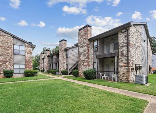 Apartment exteriors at Brighton Place in Lewisville, TX
