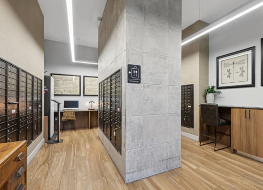 Indoor mail room close to the lobby area with computer center and food delivery pods at Bay Village 1 in Palmetto Bay, FL