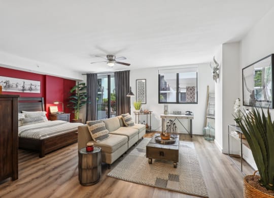 a living room with a couch and a bed
