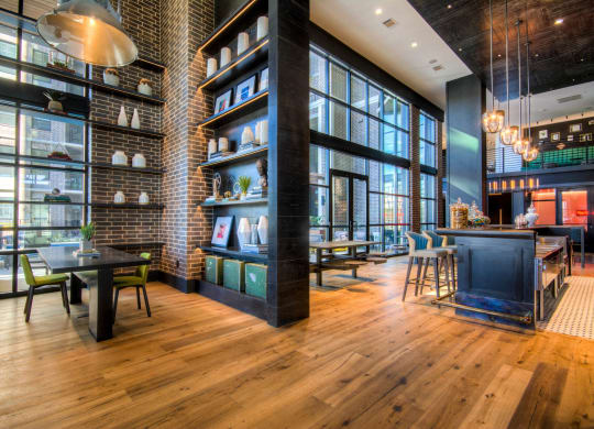 Large community space featuring a resident bar at The Case Building in Dallas, TX