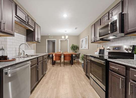 3 Bedroom Unit| Virtually Staged Kitchen at Capital Grand in Tallahassee, FL