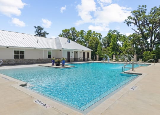 Swimming pool behind the leasing office at Capital Grand Apartments in Tallahassee, FL