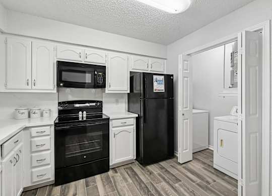 Model unit kitchen at Chisholm Place in Plano, TX