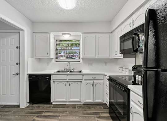 Model unit kitchen at Chisholm Place in Plano, TX