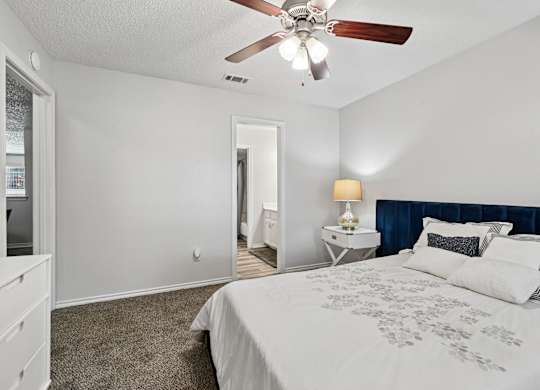 Model unit bedroom at Chisholm Place in Plano, TX