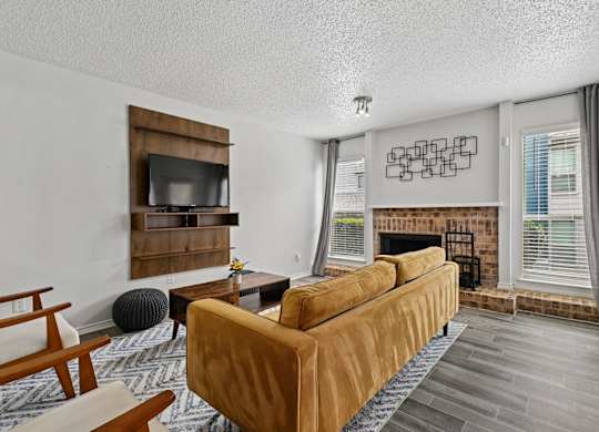 Model unit living room at Chisholm Place in Plano, TX