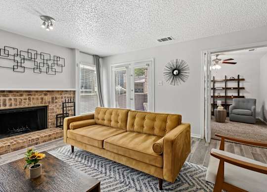 Model unit living room at Chisholm Place in Plano, TX