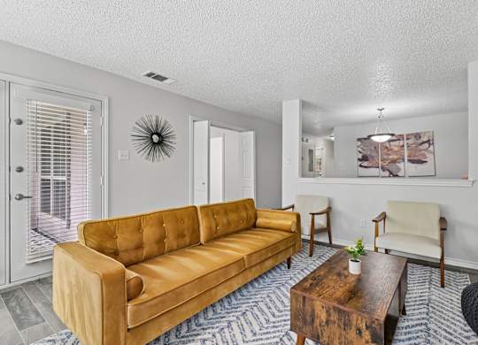 Model unit living room at Chisholm Place in Plano, TX