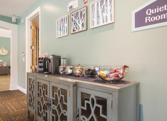 Cozy coffee area with a modern setup for residents to enjoy at Angel Landing apartments in Pensacola, FL