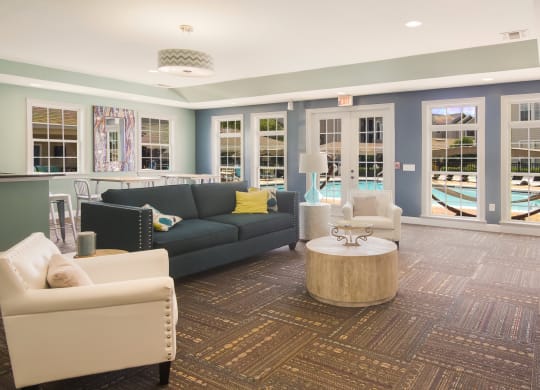 Stylish and spacious clubhouse interior with comfortable seating at Angel Landing apartments in Pensacola, FL
