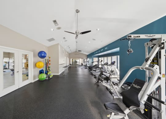 View of entire fitness room at Davenport Apartments in Dallas, TX