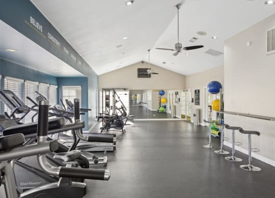 Alternate view of fitness room with stools and cardio machines at Davenport Apartments in Dallas, TX